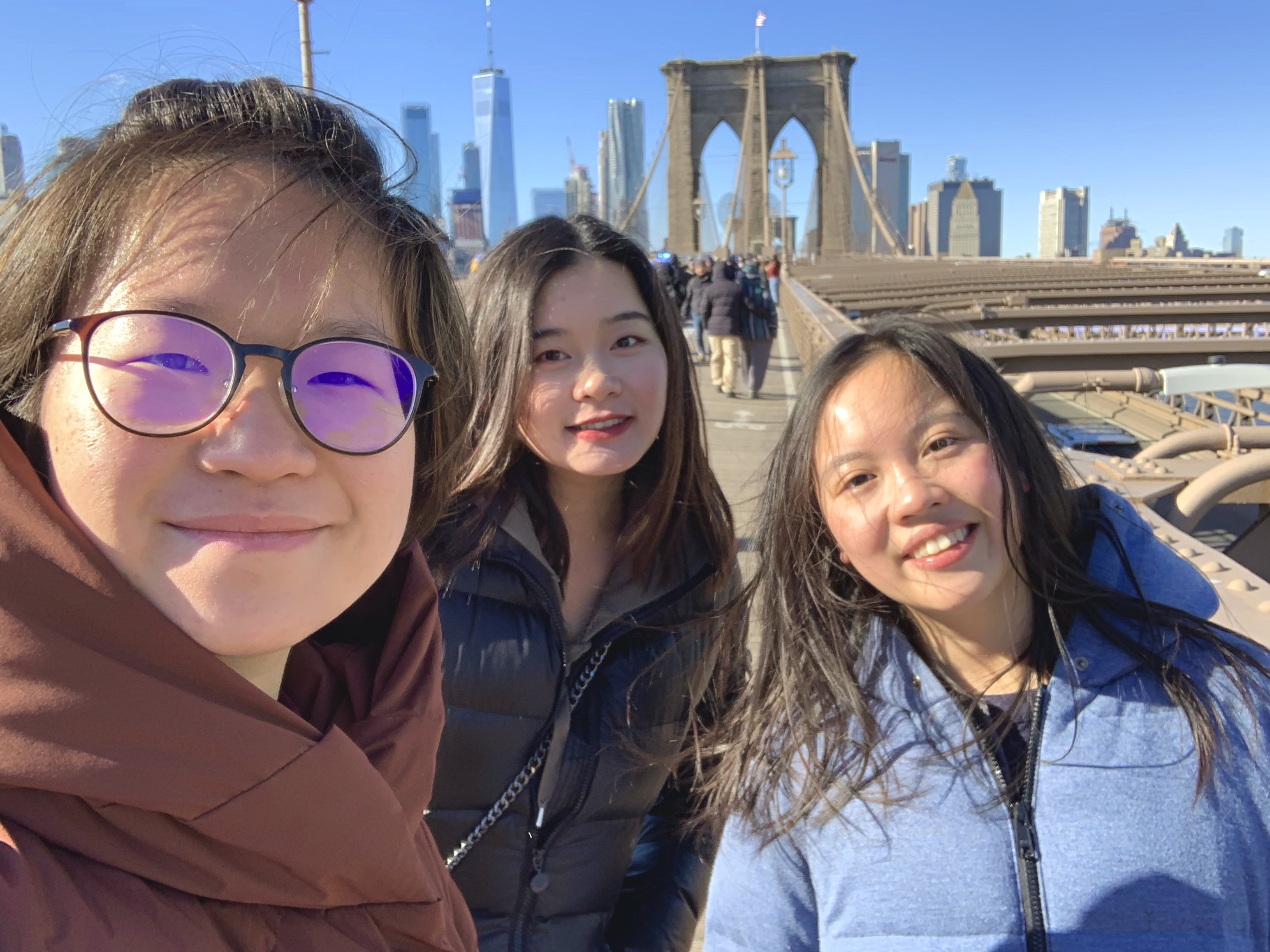 On Brooklyn Bridge with Manhattan skyline in background