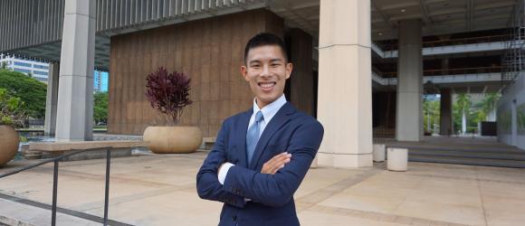 Sayama, standing in front of the Hawaii State Capitol