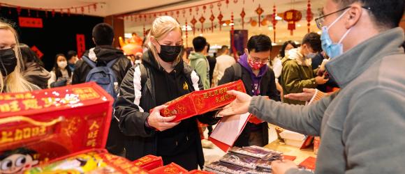 Student receives Chinese New Year gift bag