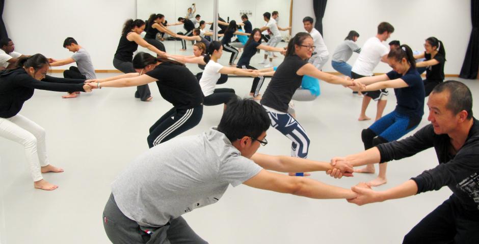 During the dance workshop, students paired up for warm up stretches, working with their partner in a balance of body weight exertion. (Photos by: NYU Shanghai)