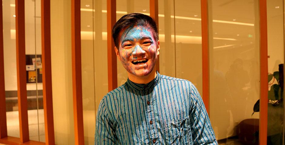 To celebrate Holi Festival, a Hindu festival with colored powder and water fights, the Food and Festivals Club dusts students' faces with colored chalk. March 6, 2015. (Photo by Annie Seaman)