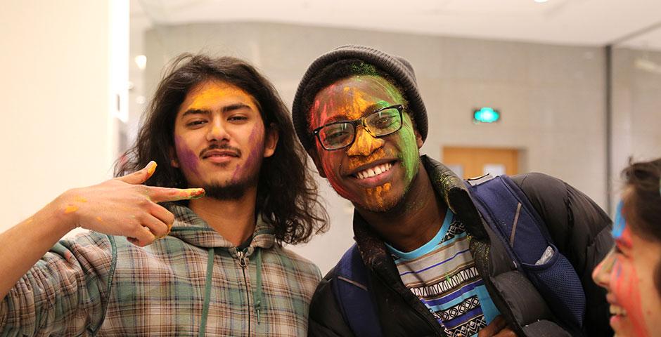 To celebrate Holi Festival, a Hindu festival with colored powder and water fights, the Food and Festivals Club dusts students' faces with colored chalk. March 6, 2015. (Photo by Annie Seaman)