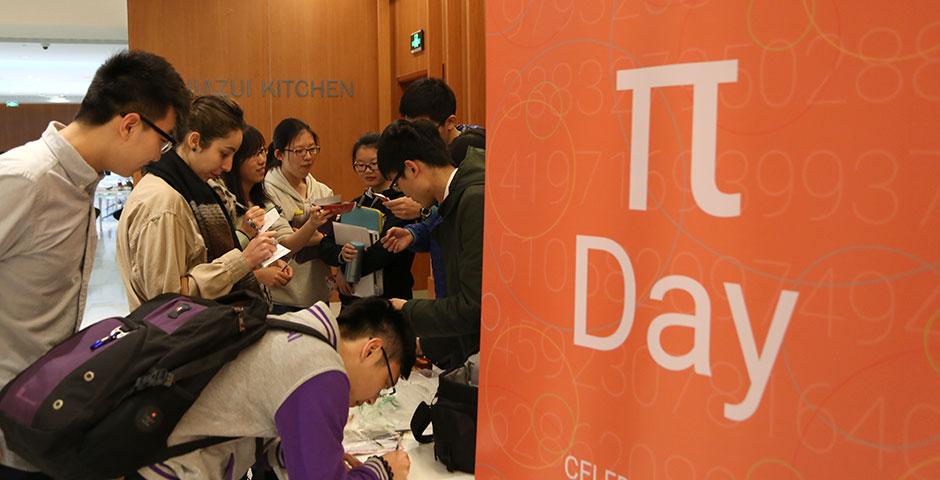 To celebrate Pi Day 2015, Math Society awarded slices of pie to students who could recite over 11 digits of pi. Congratulations to Omer Cohen (207 digits), Ziyuan Huang (100 digits), and Siyao Fang (83 digits), who placed first, second, and third, respectively. March 16, 2015. (Photo by Sunyi Wang)