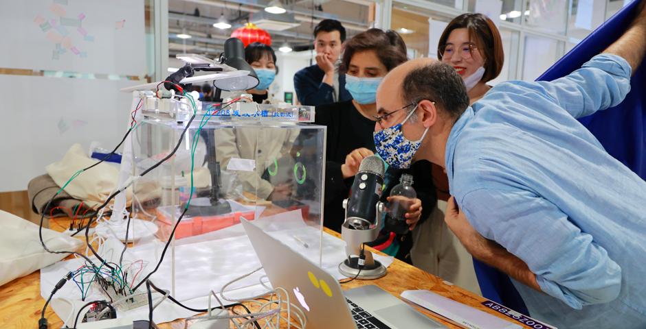 Interactive Media Arts:  Interaction Lab student Yang Jiani ’22 created “Interfering Liquid Earphone,” a sound-activated machine  demonstrating how waves propagate, oscillate, and interfere through water.