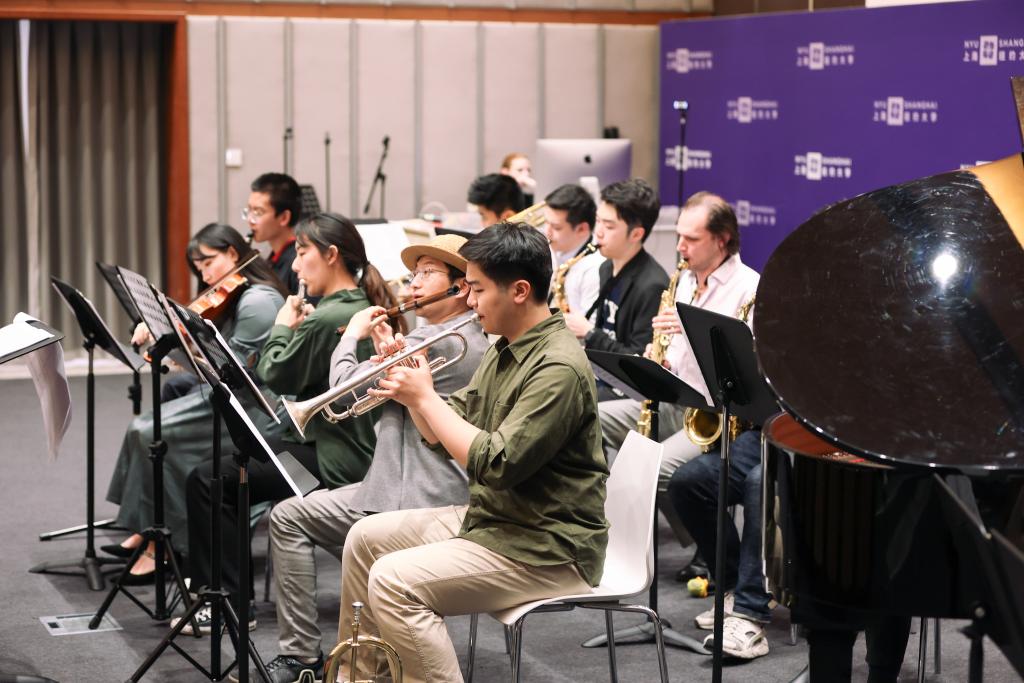 The university Jazz Ensemble had audience members tapping their feet and dancing in their seats. Led by professor Murray James Morrison, the group played two pieces, “Tea for Two” by Vincent Youmans (arr Morrison) and “Tongues,” a piece composed by Morrison, that is designed to symbolize language and culture.