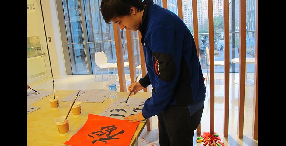 Student activities marking the celebration of Chinese New Year included paper-cutting craft workshops, games and scroll painting. (Photo by: NYU Shanghai)