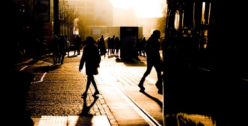 By Guillermo Carrasquero (Berlin)    Photo of the trance inducing afternoon sun of Berlin, the city of adventures and human transparency. This picture shows not only the beautiful afternoon but the pacing and feel of the city as we see the citizens of these streets walking in all directions, while not missing the classic Berlin tram.