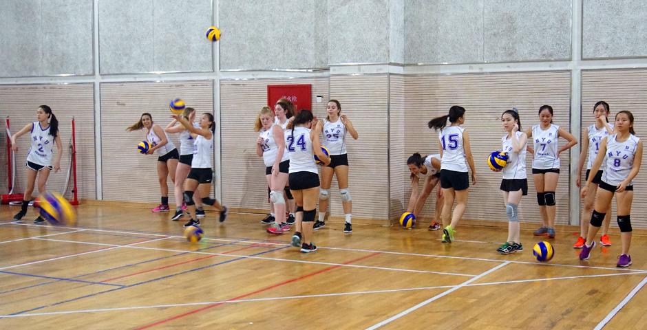 The NYUSH Women's Volleyball team took to court against ENCU, losing out to the partner school on October 20. The team warms up. (Photos by: Nacole Abram)