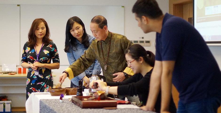 Steeped in tradition, students honed their tea ceremony technique at an April 13 workshop hosted by Food & Festivals and Heath and Wellness. (Photo by: NYU Shanghai)