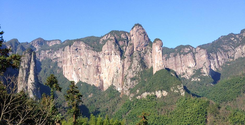 These mountain peaks were the first things we would see when we woke up. Every morning, we would gather in the village to eat a homemade breakfast. My favorite dish was a tofu (made from scratch the night before) and noodle soup with salty peanuts and pickled vegetables. I would also eat steamed bread with a tea egg, an egg hard boiled in tea.  (Photo by: Annie Seaman)