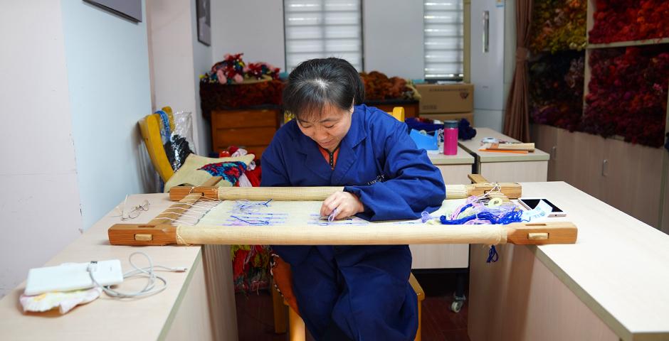 Needlepoint tapestry is a disappearing art form. The center is subsidized by the Shanghai government, and employs 12 craftspeople -- all of whom are in their 60s.