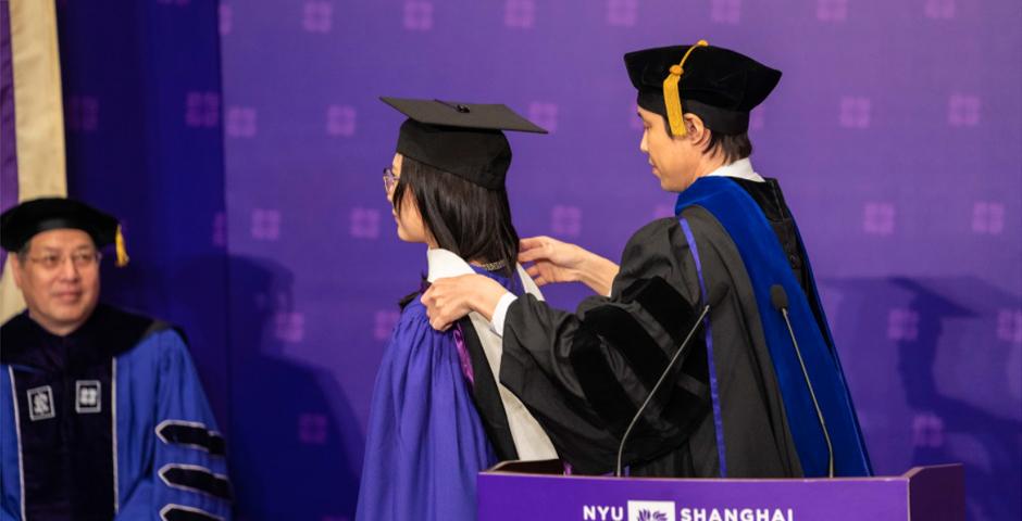 Professor and TESOL Program Director Kentei Takaya hooded Xu Siqi, MA ‘20, on behalf of all Teaching English as a Second Language Program graduates.