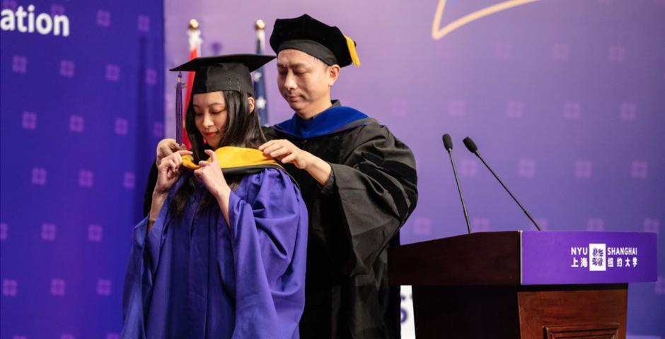 Professor Ming Liao hooded Chen Yijie, MS ‘20, on behalf of all Data Analytics and Business Computing Program graduates.