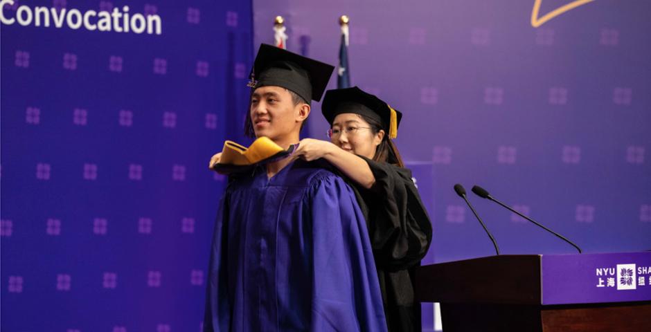 Professor Christina Wang hooded Dai Weiduo, MS ‘20, on behalf of all Quantitative Finance Program graduates.