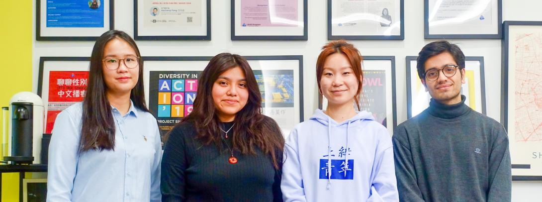 four NYU Shanghai students are pictured here posing for a group photo.